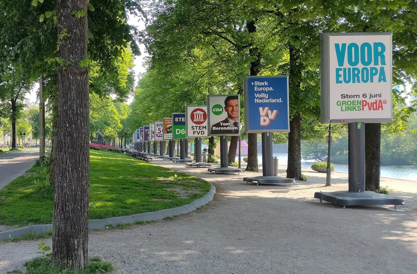 Rows of election posters for Dutch parties along a canal in The Hague.